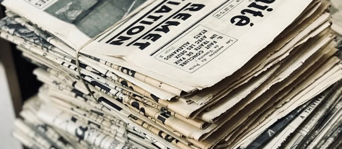 bundle of newspaper on table
